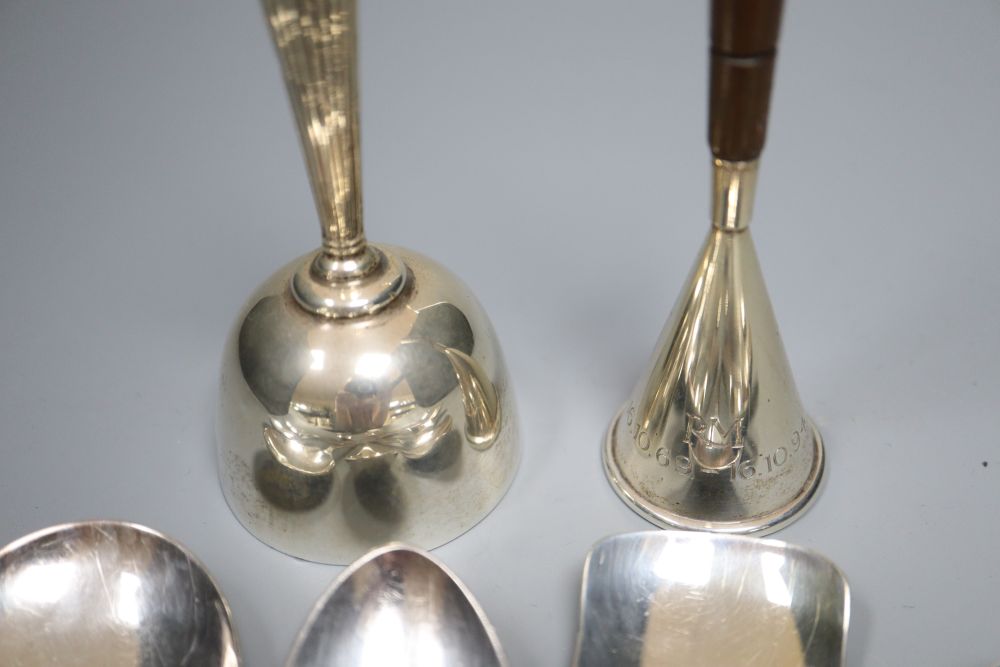 A silver christening knife and fork, a modern silver hand bell, a similar sterling bell and minor plated spoons.